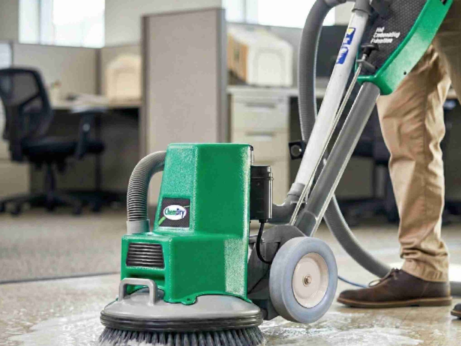Rotary scrubber cleaning an office floor